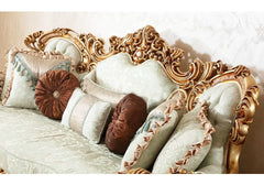 zoom view of wooden carving on sofa